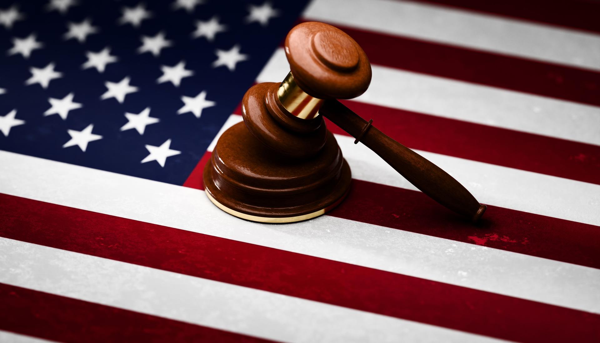 Gavel sitting on top of textured American flag
