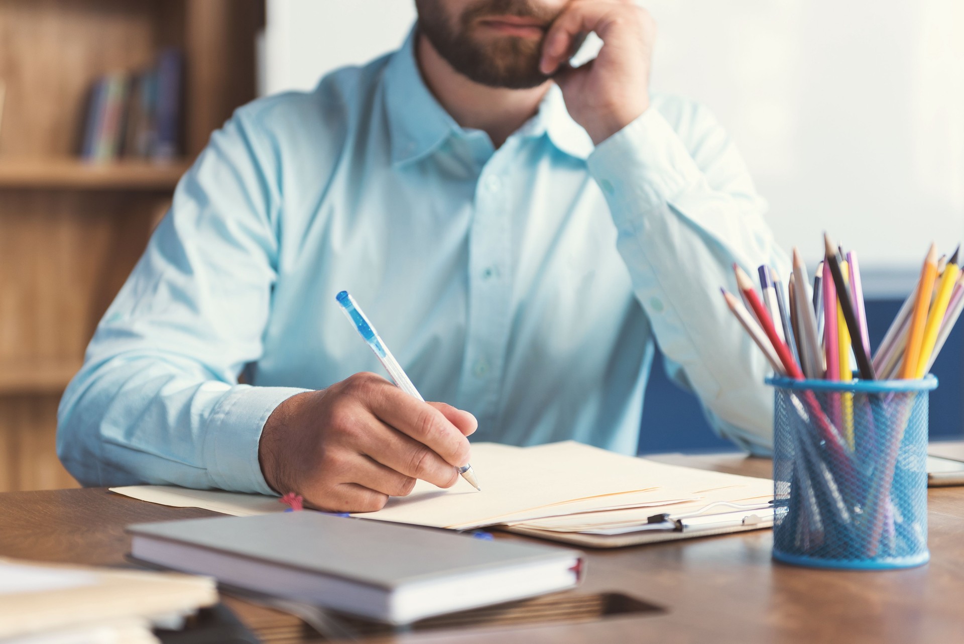Young guy with beard doing test for candidates in office